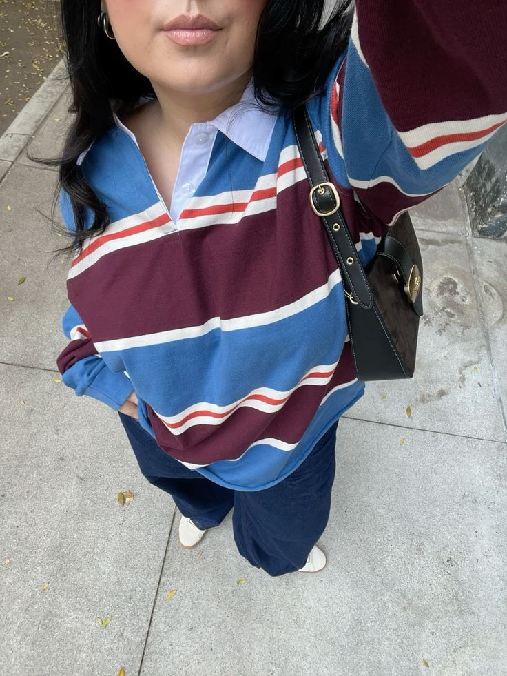 Girl wearing maroon and blue rugby shirt and Balloon trousers & Rugby shirts