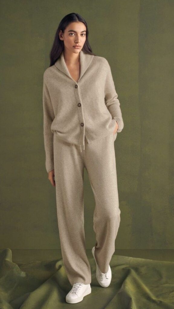 woamn wearing biege sweater and sweats loungewear