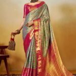 woman wearing a pink orange and green saree color