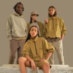 4 people wearing Essentials Clothing