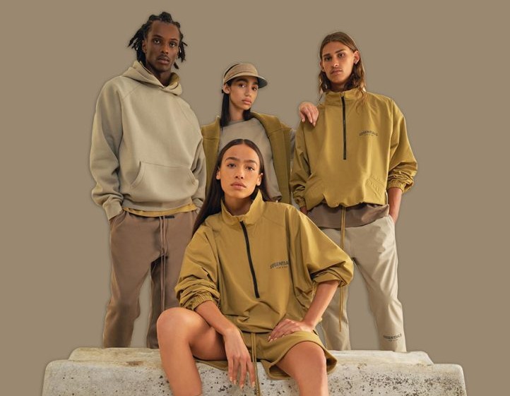 4 people wearing Essentials Clothing