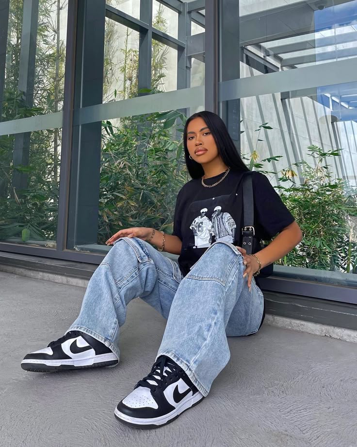  Girl wearing jeans and T shirt with her Nikes to provide a Nike Dunk Low Women Outfit idea