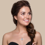 A woman wearing a diamond necklace