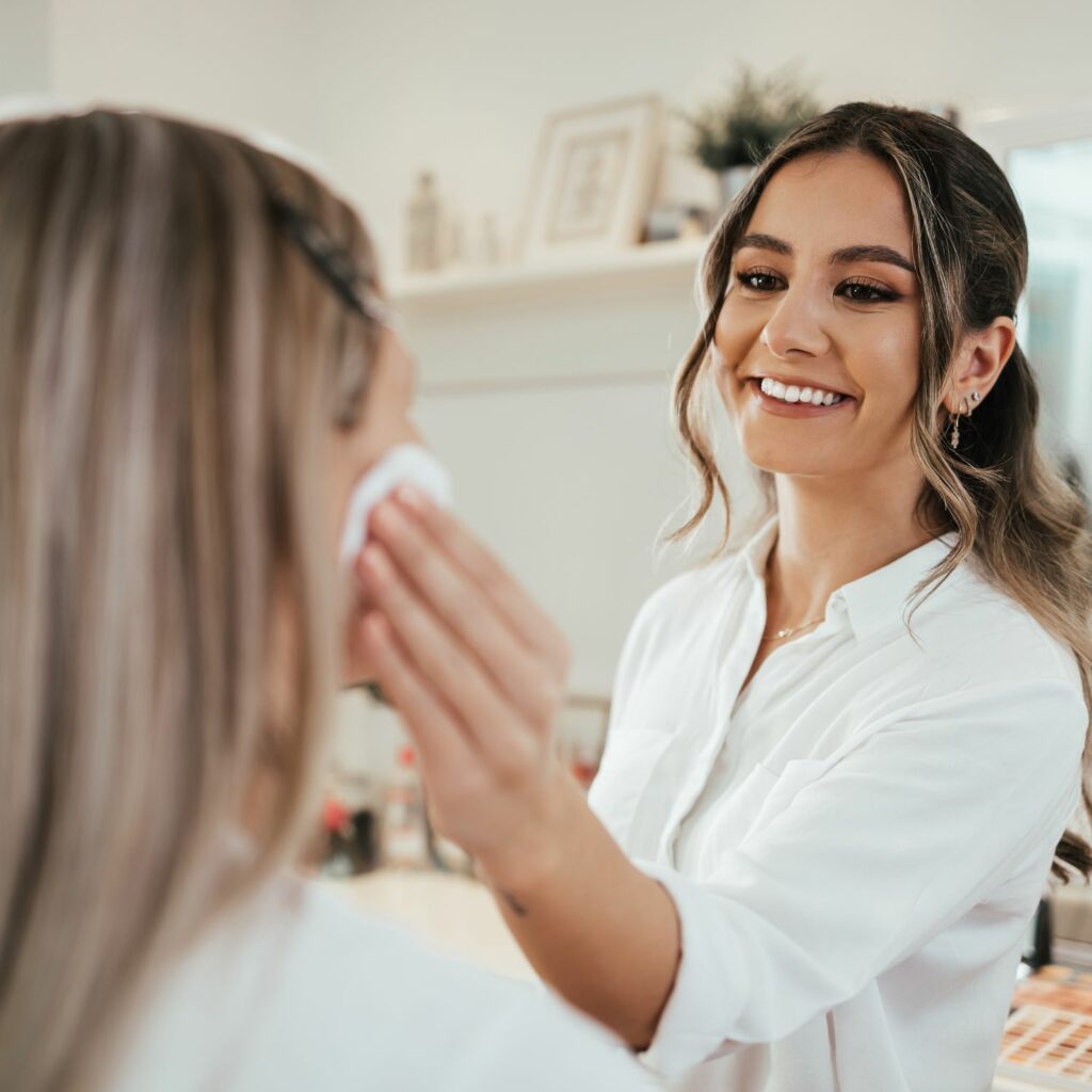 woman having makup applied bridal cosmetic mistakes