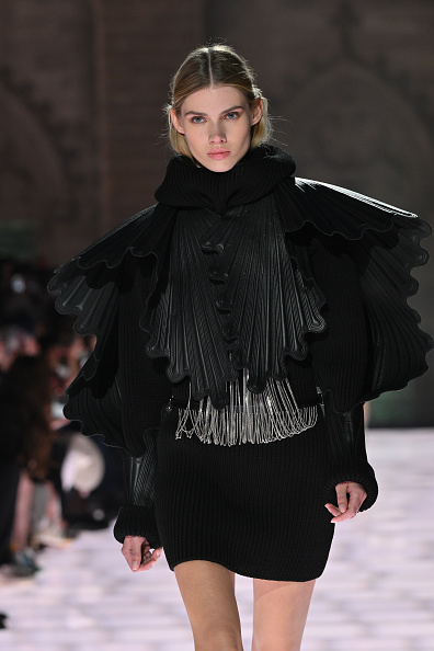 Cara Schädel walks the runway at the Louis Vuitton Women’s Resort 2026, held at the Palais des Papes in Avignon, France.