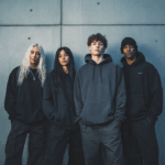 4 people wearing Essential hoodies