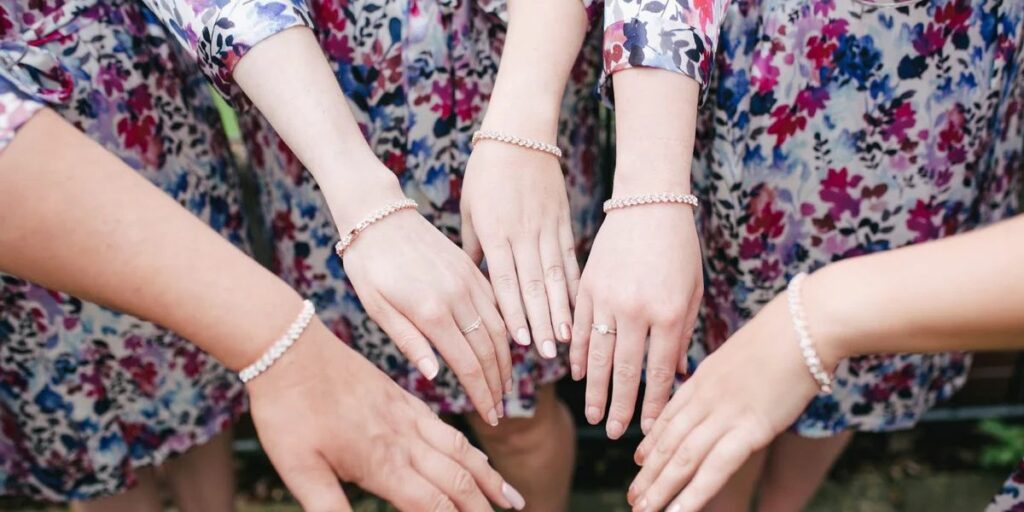 5 wrists wearing bracelets for women