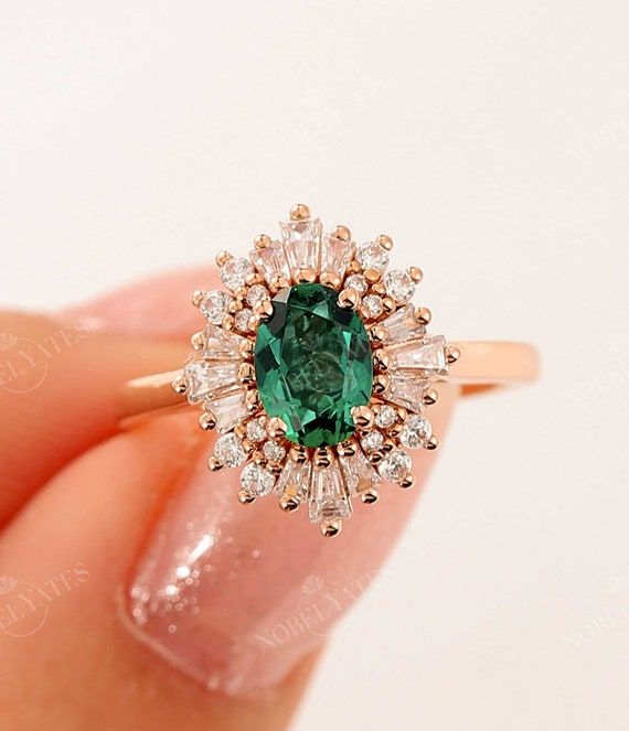 Hidden Halo emerald engagement rings