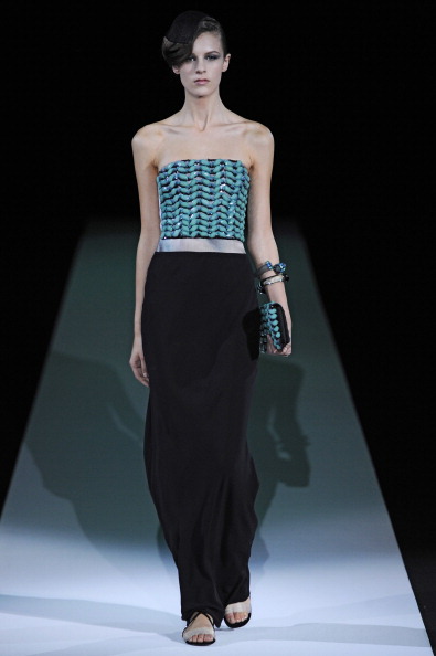 A model walks the runway during the Giorgio Armani Spring/Summer 2013 fashion show
