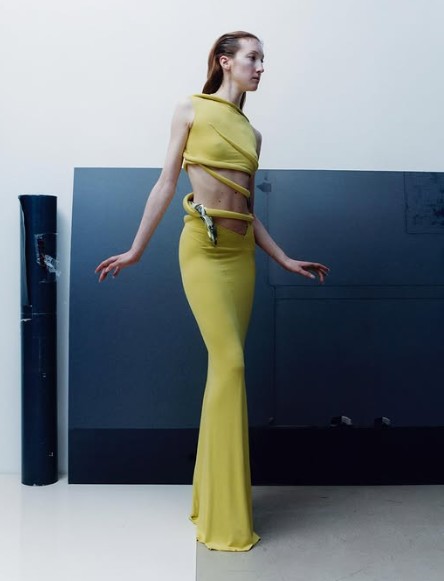 Standing ground green dress with open mid section