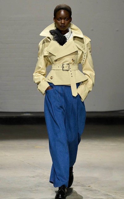 S.S. Daley white leather top with blue baggy slacks