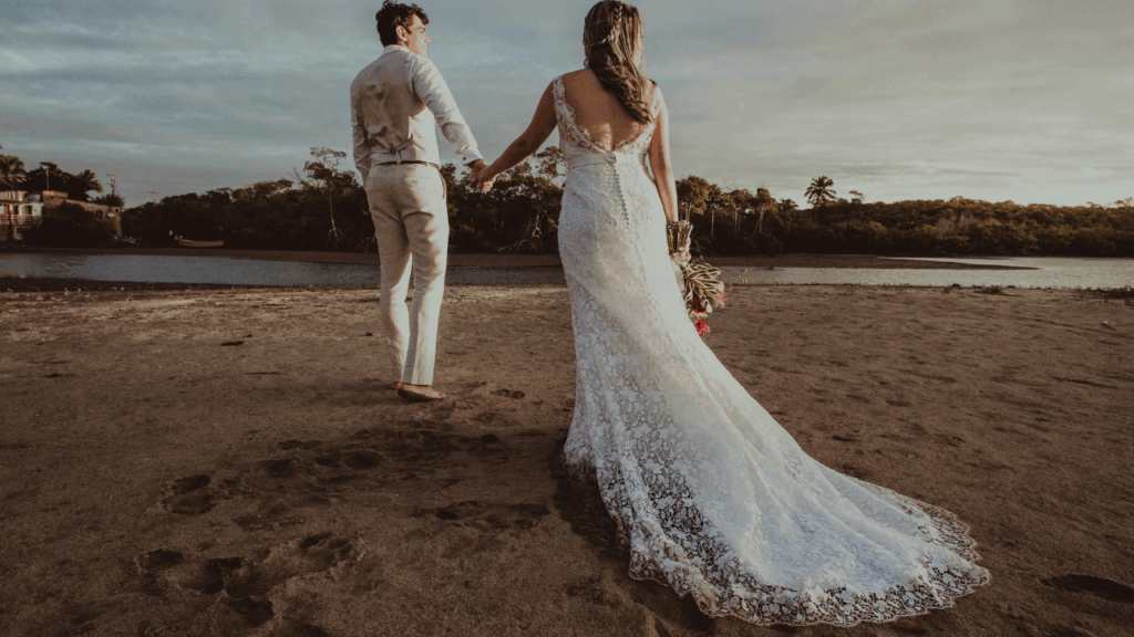wedding couple walking on the beach