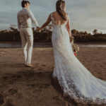 wedding couple walking on the beach