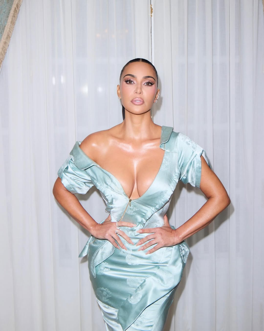 A close up of Kim Kardashian in a vintage Dior turquoise dress to the “All’s Fair” Paris premiere.