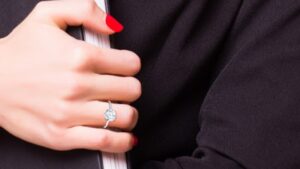 women's diamond ring on a hand