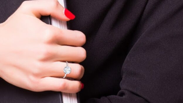 women's diamond ring on a hand