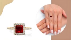 wom ans hand wearing natural ruby ring