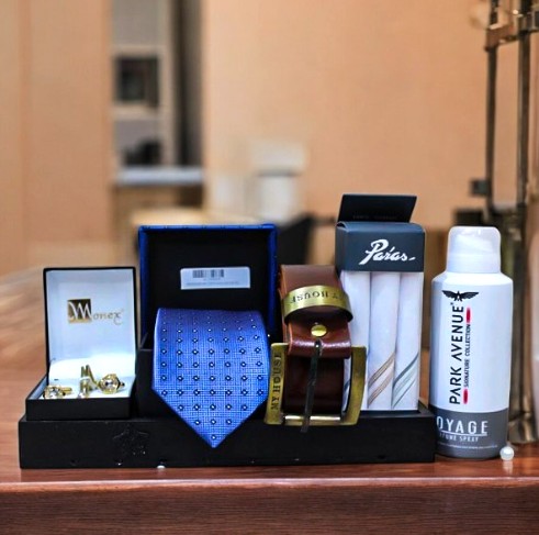 Mens affordable anniversary gifts online. A tie, belt cufflinks or body spray 