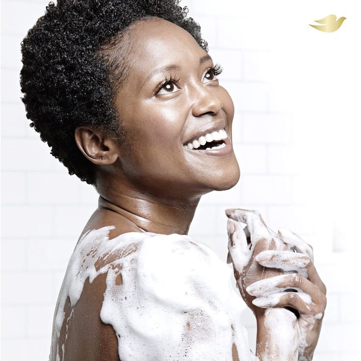 a woman using Dove Body Wash