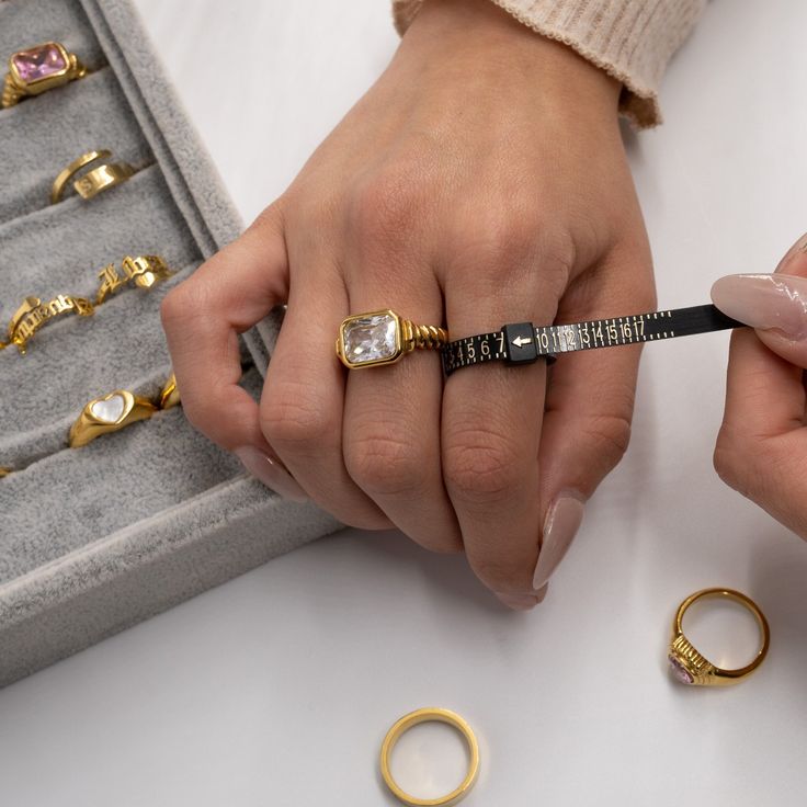 hand with rings and Ring Sizer