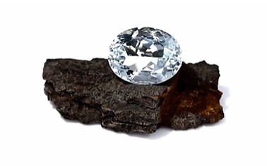 aquamarine stone on bark 