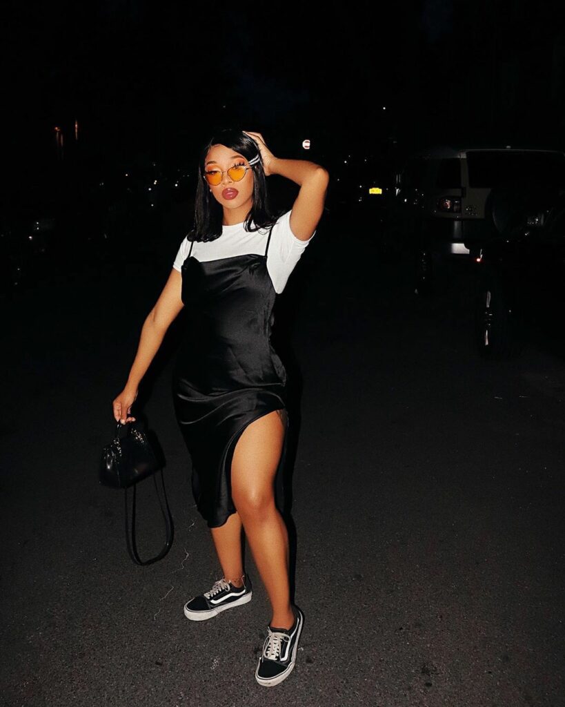 Model in black slip dress 