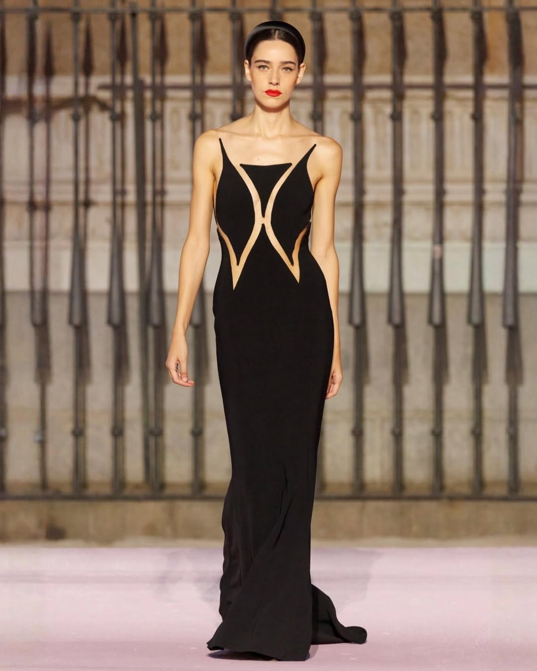 Catarina Santos models a black cutout gown at the Carolina Herrera Spring/Summer 2026 presentation