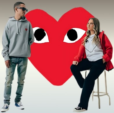 Male and female models in front of Syna world logo