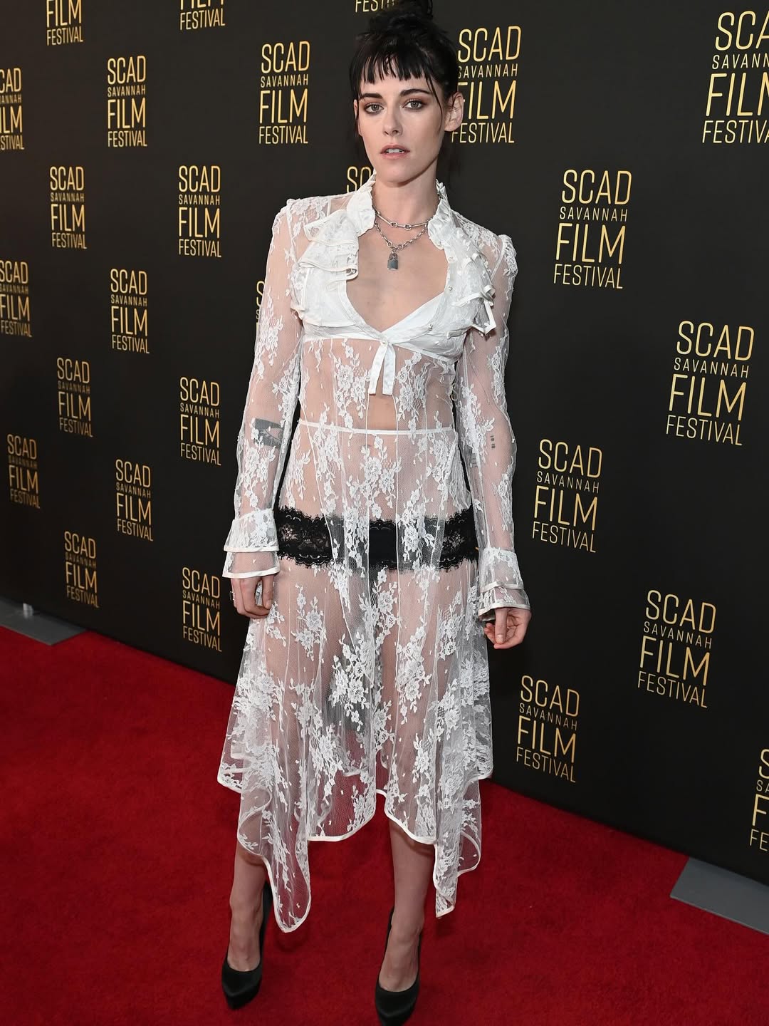 Kristen Stewart showcased her exceptional fashion sense by combining her Rodarte lace coordinated outfit with Dolce & Gabbana black velvet platform heels.