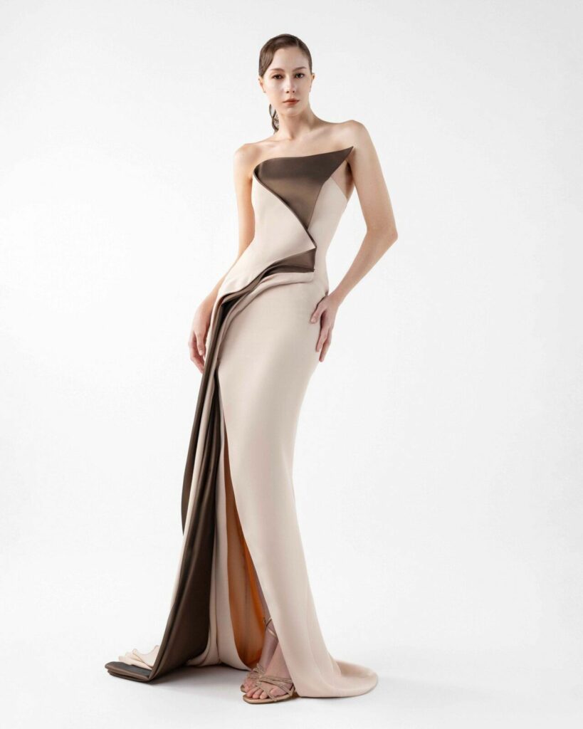 This Gaby Charbachy dress features a strapless, straight-across neckline