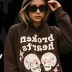 Model wearing a Broken Planet Hoodie