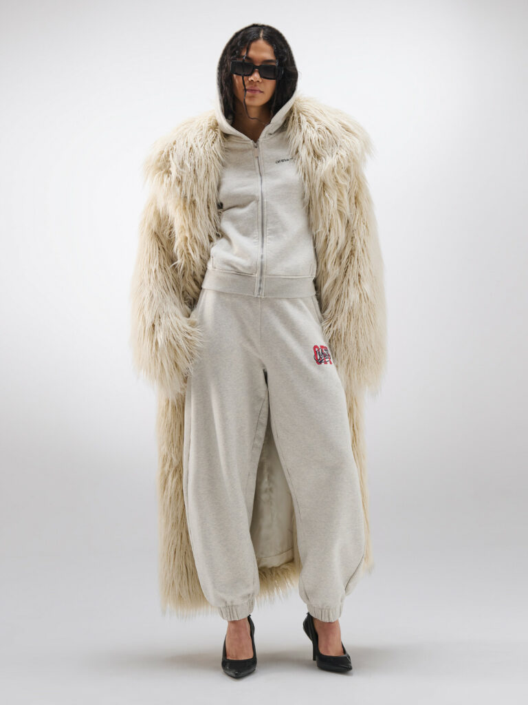Model wearing Off-White long haired coat with white swaetsuit