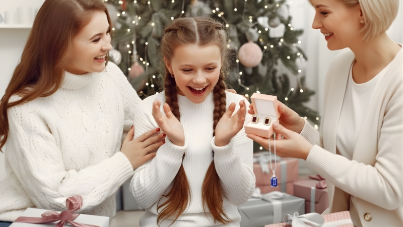 two models with girl holding ruby earrings and saphire necklace online Black Friday sale