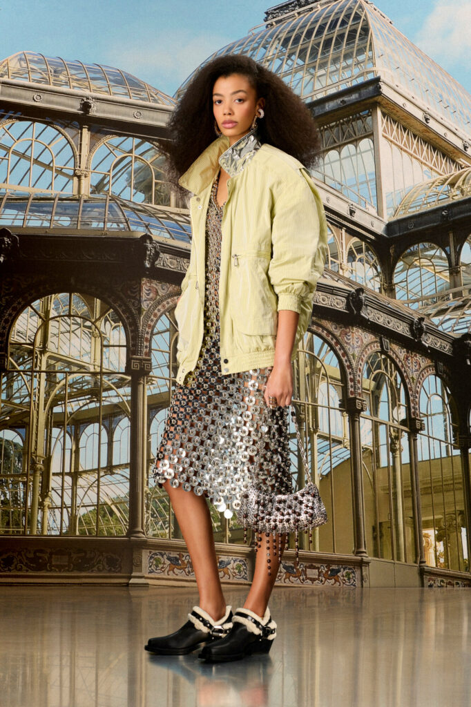 dress of disk type material and green jacket