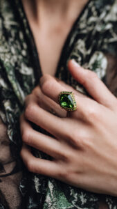 woman wearing a Tsavorite garnet ring